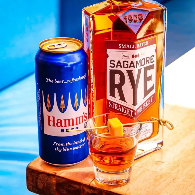 Hamm's beer, Sagamore Rye, and a shot with cheese on wood.