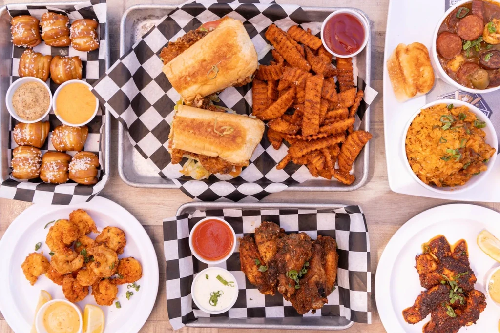 Top-down view of a diverse spread of casual restaurant food.