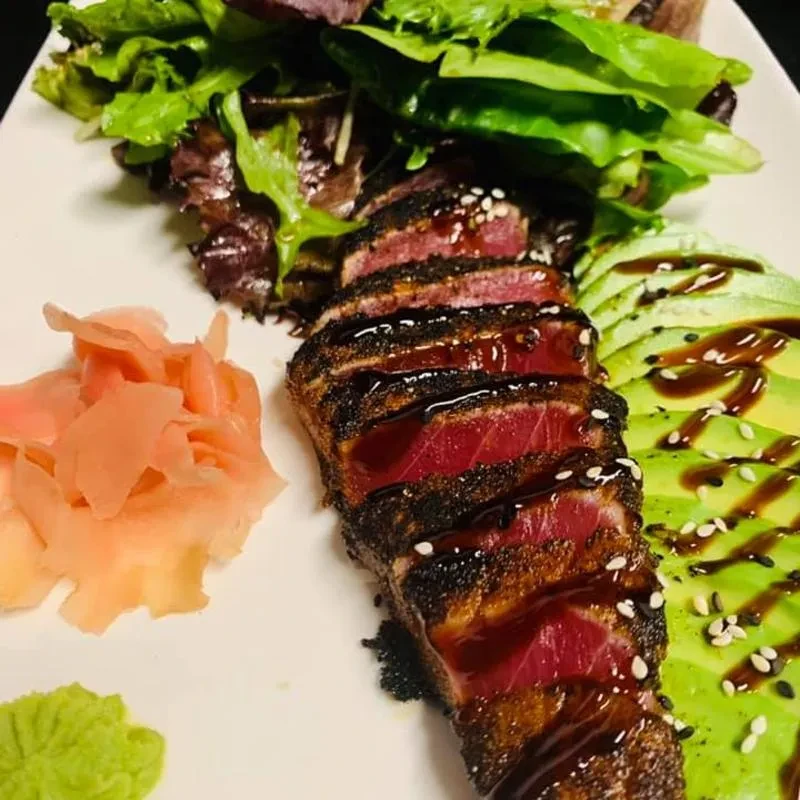 Seared tuna, avocado, mixed greens, pickled ginger, and wasabi.