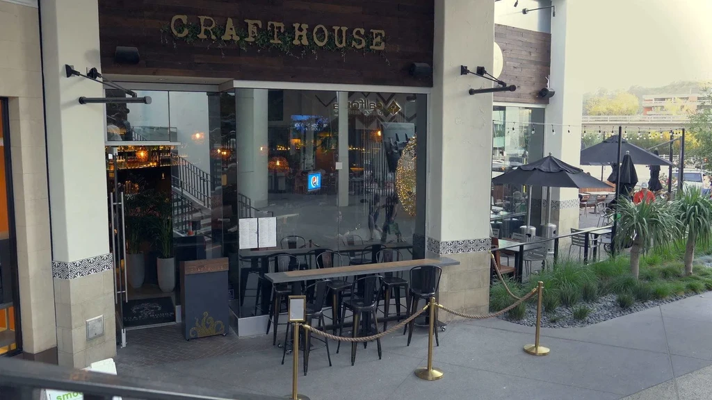 CRAFTHOUSE restaurant storefront and outdoor patio in an urban setting.