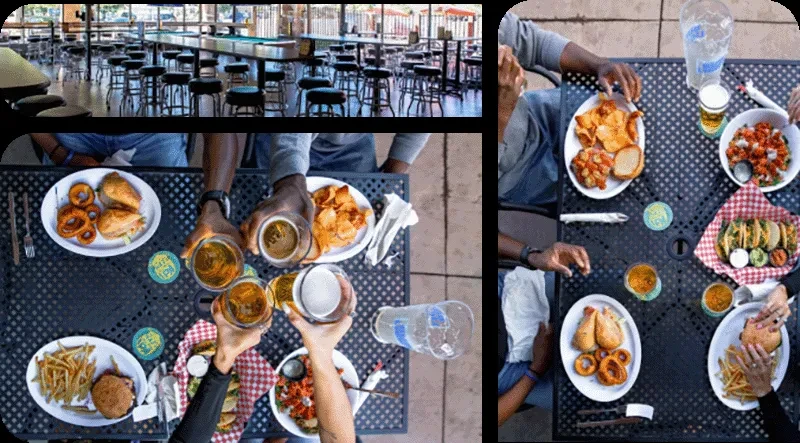 Indoor bar and outdoor patio with people enjoying food and drinks.