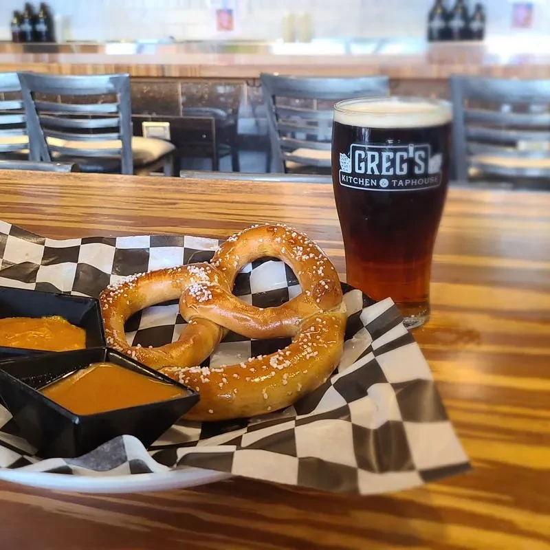 Salted pretzel, two dips, and Greg's Kitchen taphouse beer.