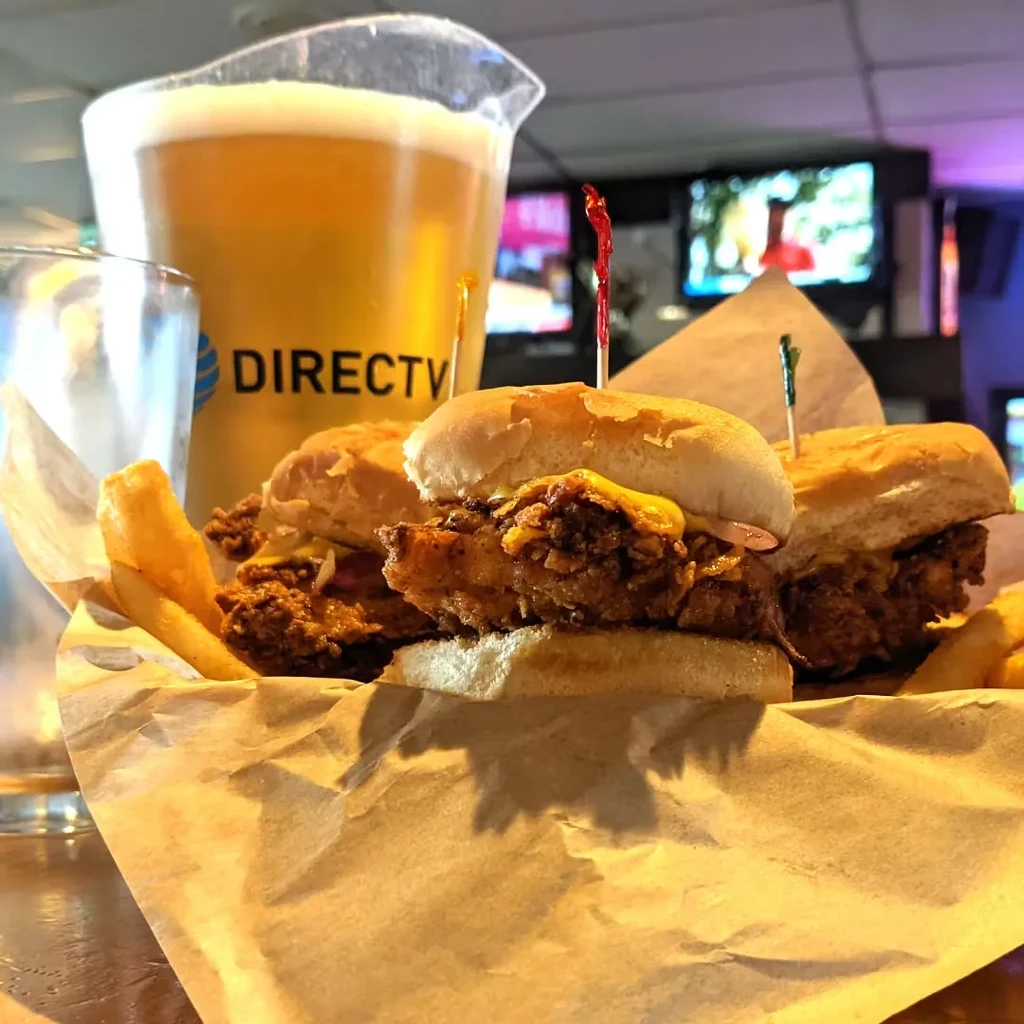Fried chicken sliders with cheese, fries, and a DIRECTV beer pitcher.
