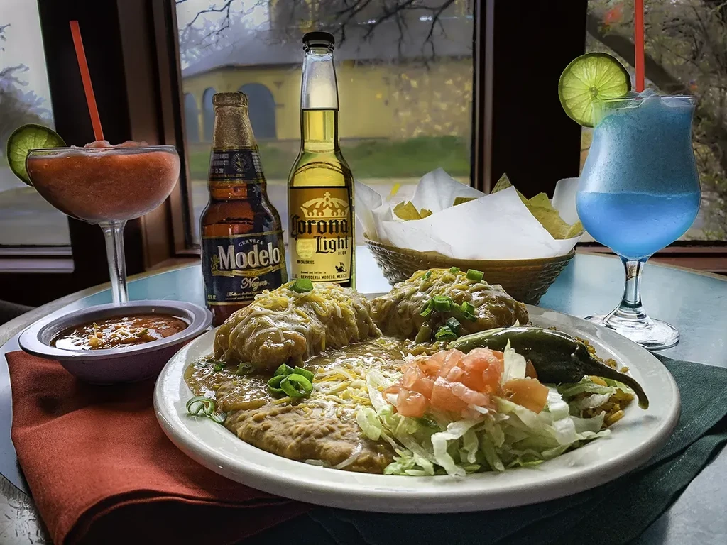 Mexican green enchiladas, beans, rice, beers, and colorful frozen margaritas.