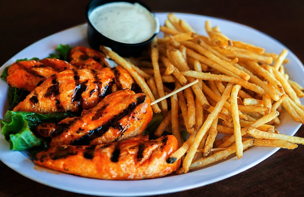Grilled chicken tenders, shoestring fries, lettuce, and dipping sauce.