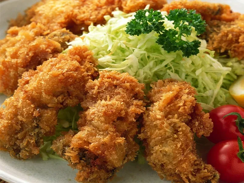 Crispy golden-brown katsu, shredded cabbage, tomatoes, lemon.