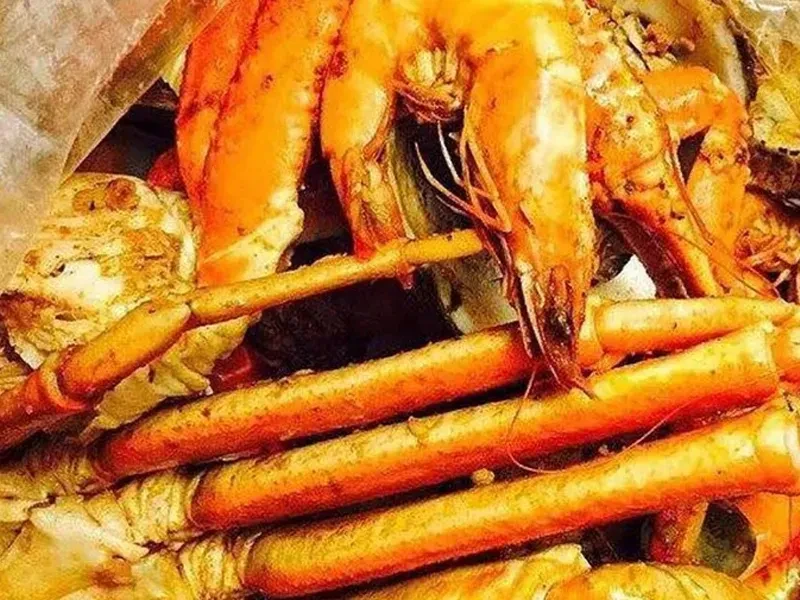 Generous serving of vibrant, seasoned prawns and crab legs.