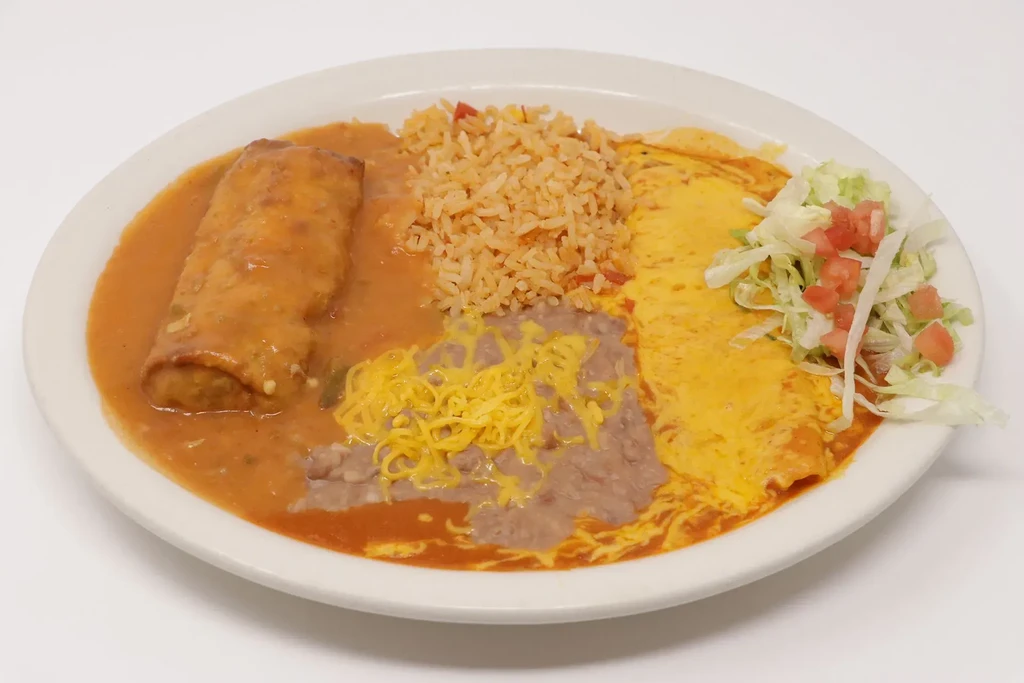 Full plate of Tex-Mex combo: burrito, rice, beans, cheese enchilada, salad.