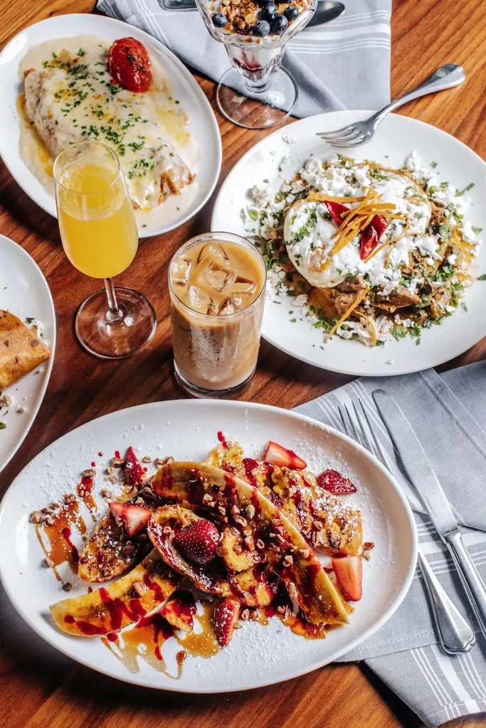 Overhead view of a vibrant breakfast and brunch spread.
