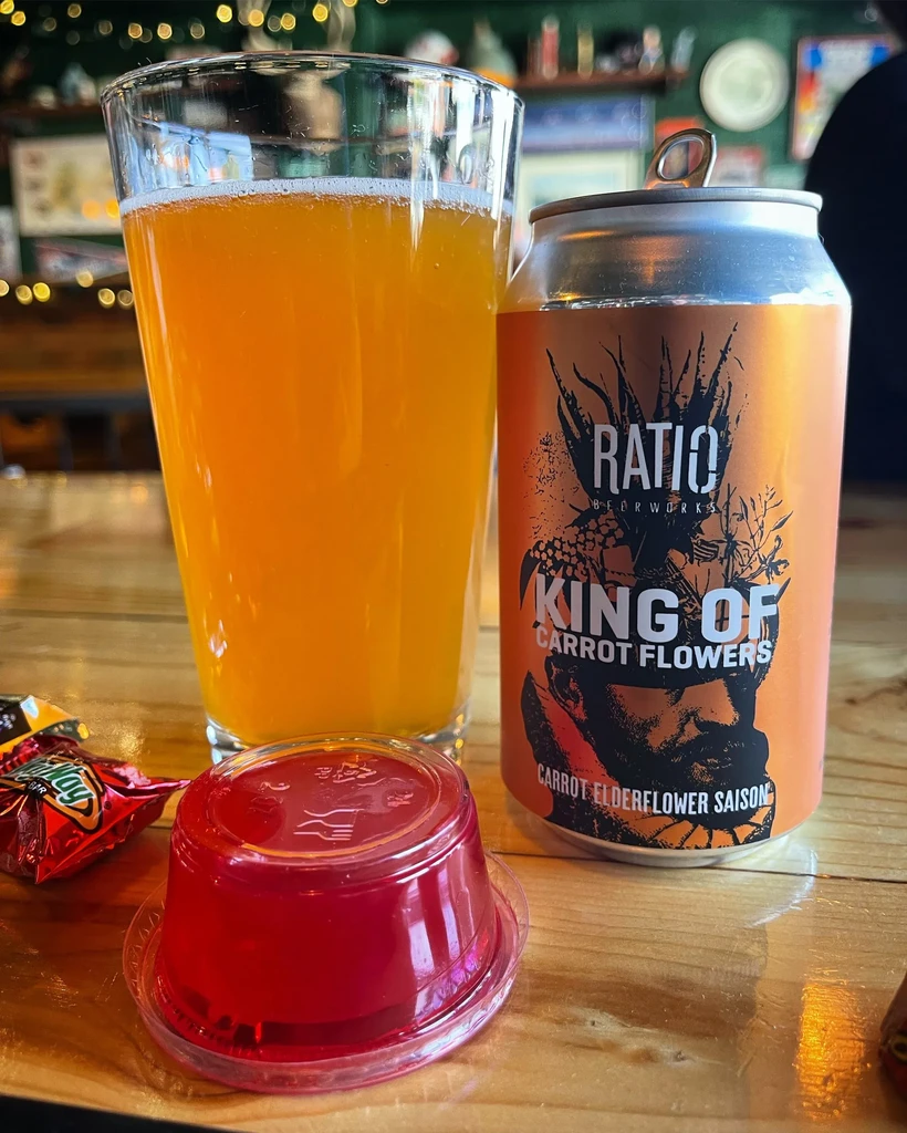 Glass of beer, craft saison can, Jell-O shot, and candy wrapper.