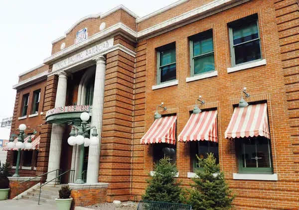 Brick building with columns, Union Pacific and Omaha Beer signage.
