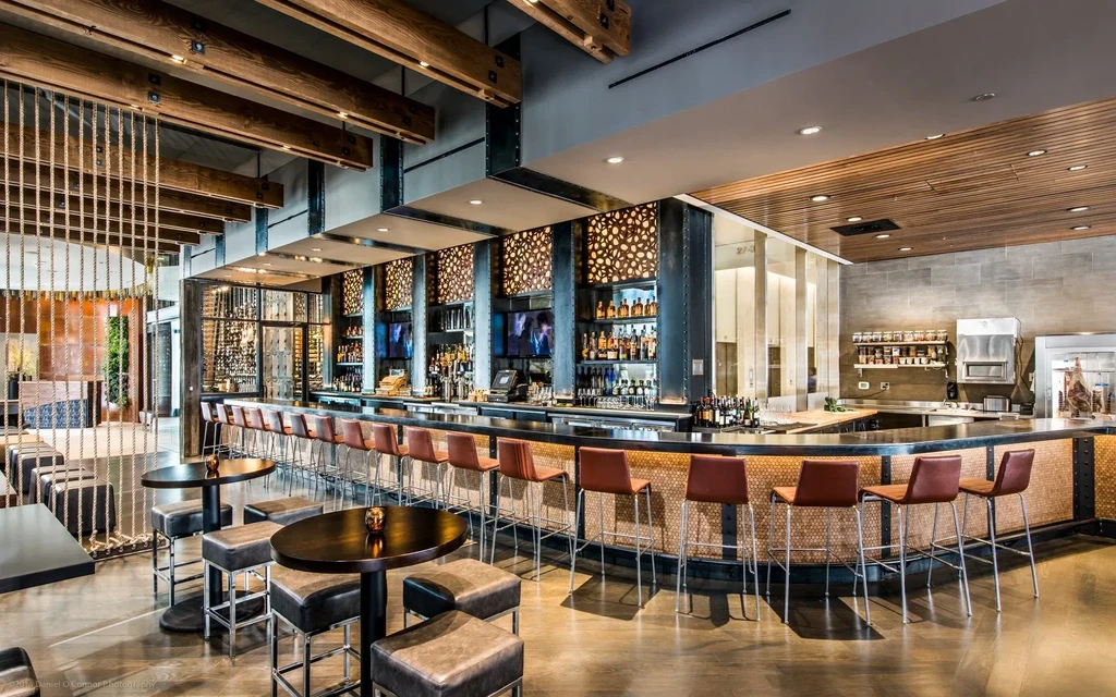 Empty, modern, upscale restaurant and bar with industrial-chic design.