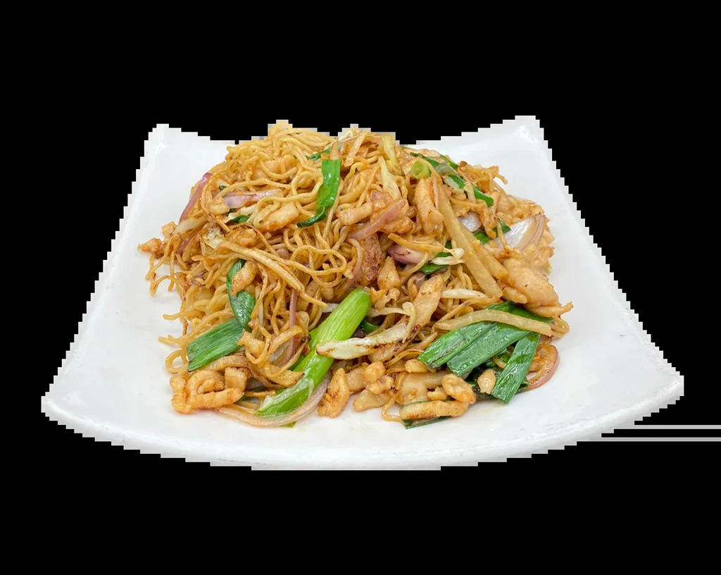 Close-up, top-down stir-fried noodles with chicken, red onion, and scallions.