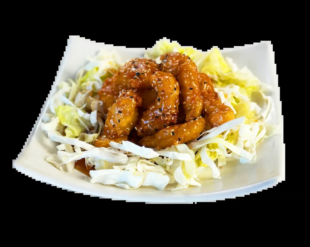 Deep-fried chicken/shrimp in reddish-orange sauce with sesame and cabbage.