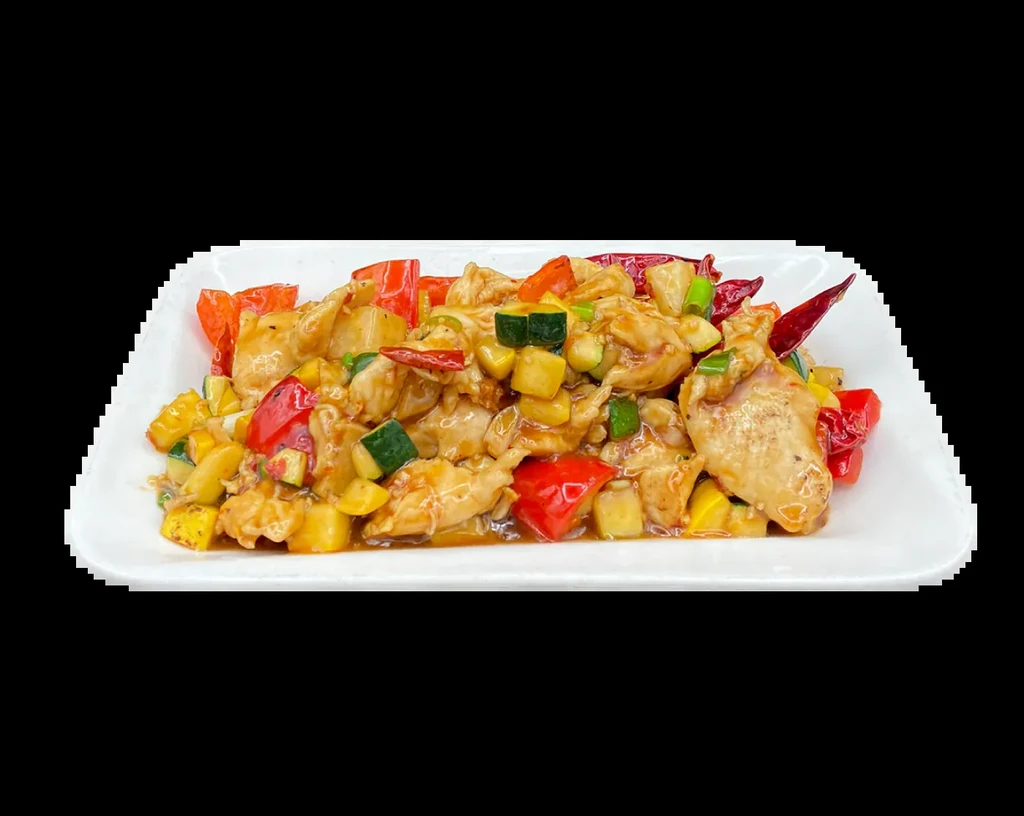 Glossy chicken and colorful vegetable stir-fry on a white plate.