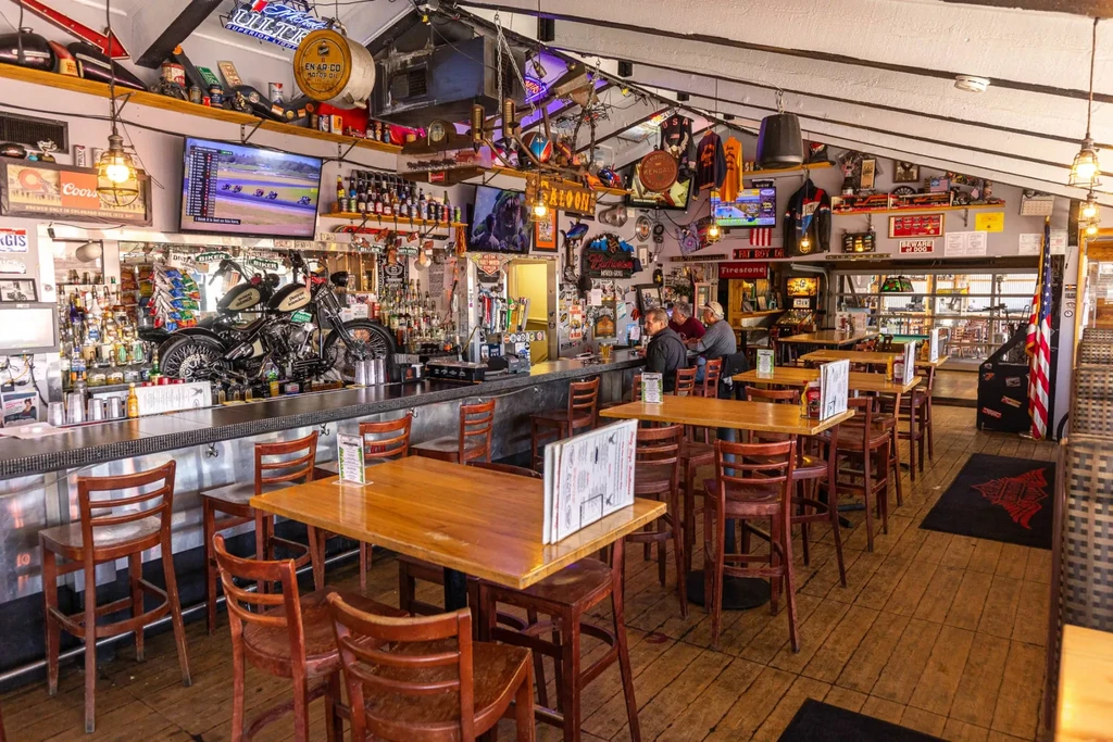 Lively, memorabilia-filled motorcycle bar with a vintage bike on the counter.