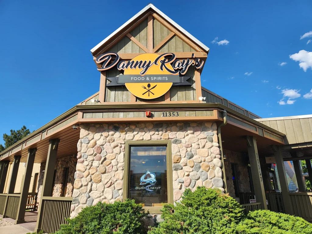 Exterior of Danny Ray's Food & Spirits, a stone and wood building.