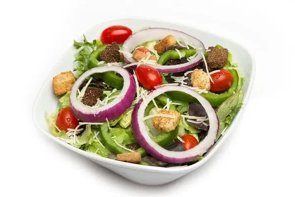 Fresh, colorful salad with lettuce, tomatoes, cheese, and croutons.