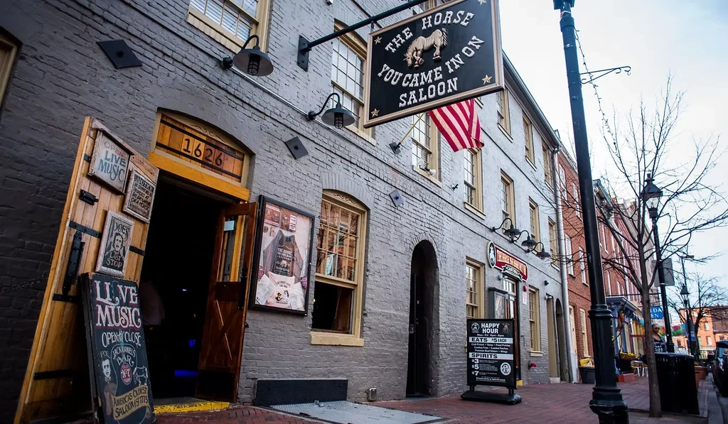 The Horse You Came In On Saloon, historic grey brick building with signs.