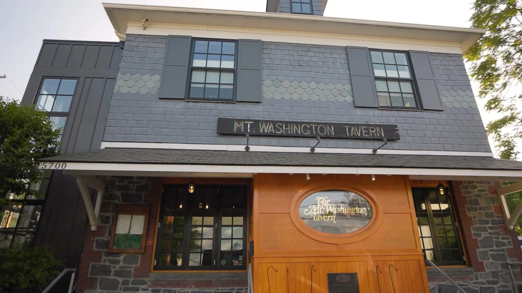 Facade of The Mt. Washington Tavern, a multi-story building with diverse materials.