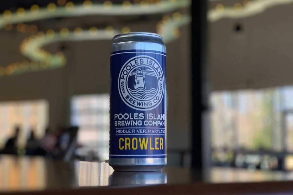 Blue Pooles Island Crowler can on a dark, reflective surface.