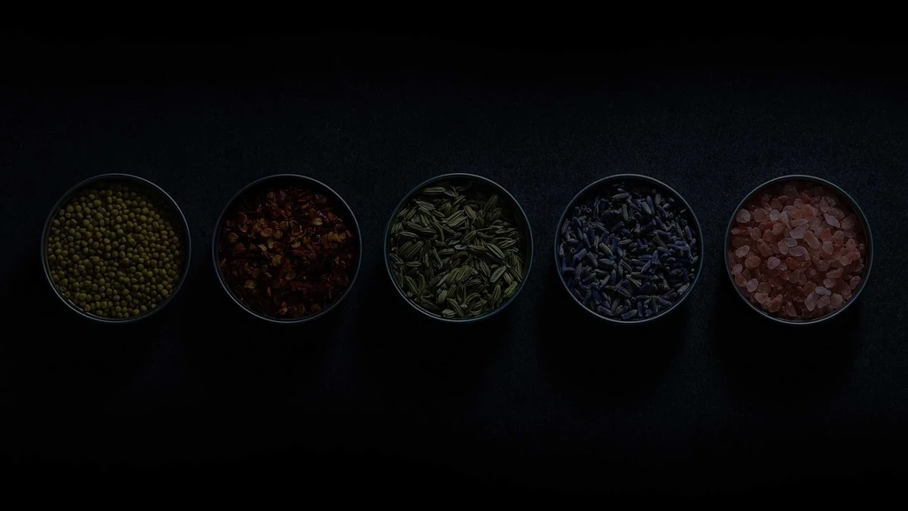 Five bowls contain green legumes, chili, fennel, lavender, and pink salt.