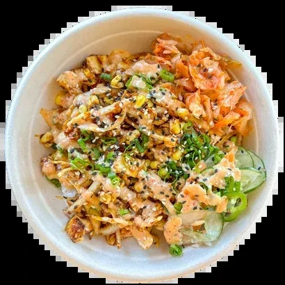 Vibrant poke bowl with protein, vegetables, creamy sauce, and sesame seeds.