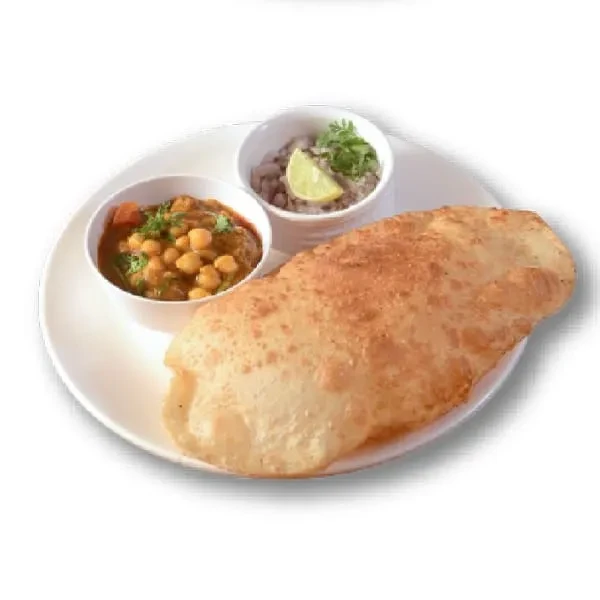 Puffed golden-brown bread with chickpea curry and lentil dish.