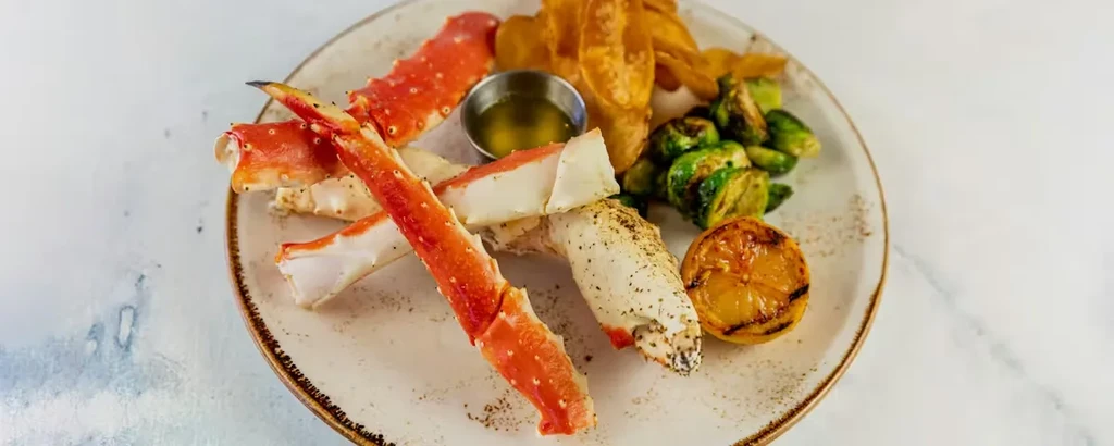 Alaskan king crab legs, potato wedges, brussels sprouts, grilled lemon, drawn butter.