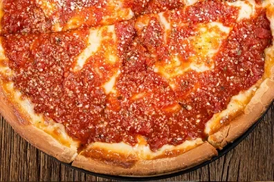 Top-down deep-dish pizza, thick crust, rich tomato sauce, melted cheese.
