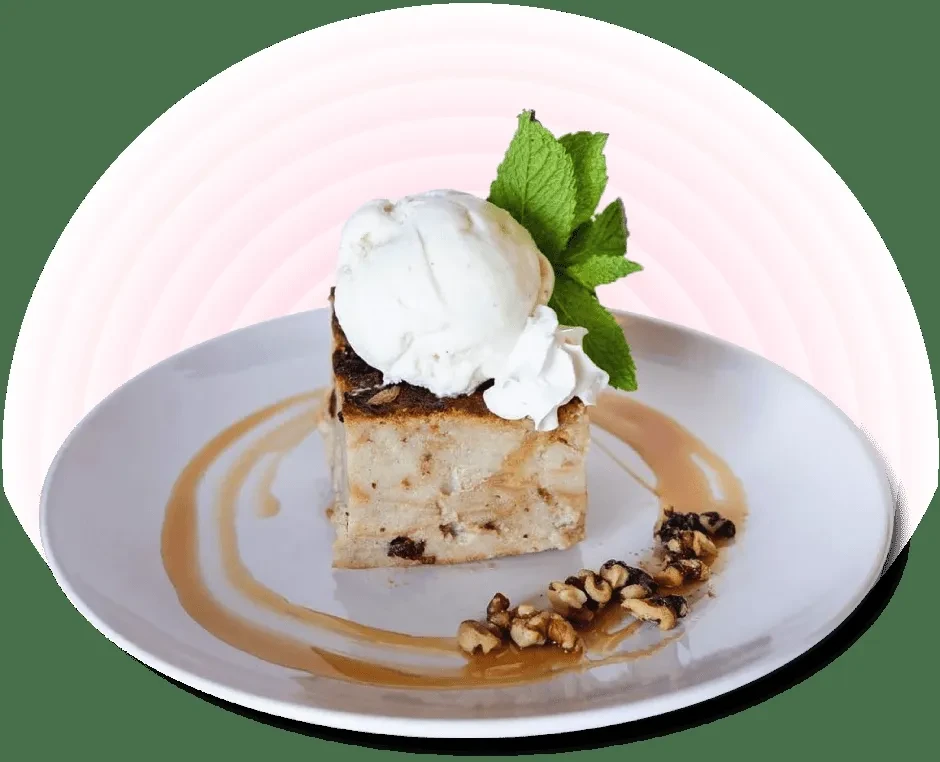 Square bread pudding, ice cream, whipped cream, mint, caramel, walnuts.