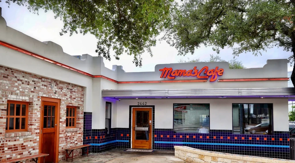 Mama's Cafe: retro exterior with mixed materials and neon sign.