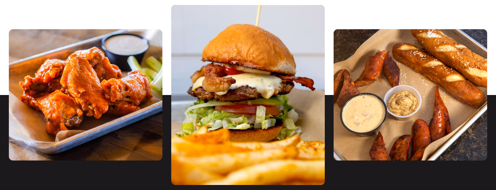 Chicken wings, bacon cheeseburger, and pretzels with sausage and dips.