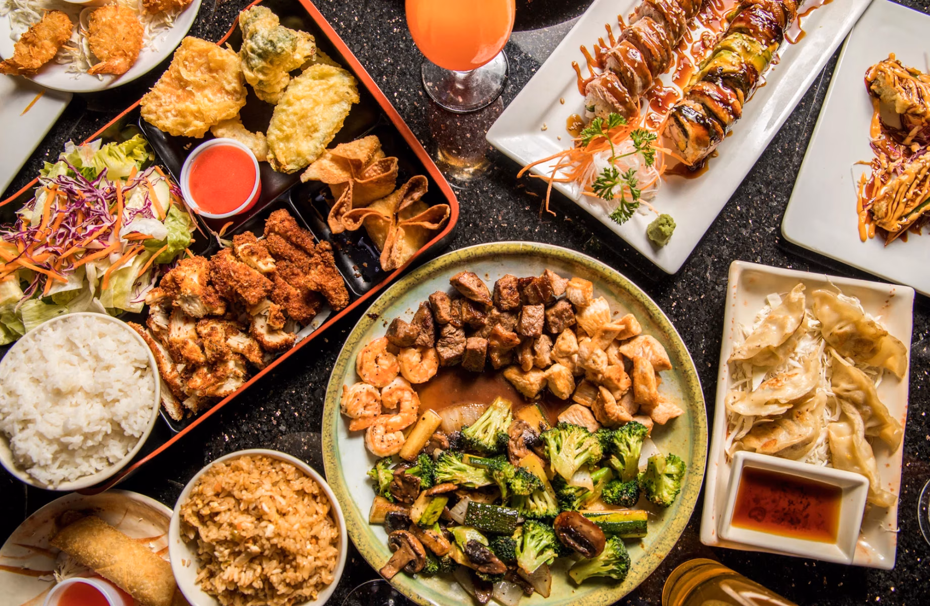 Various Japanese dishes, including sushi, bento, hibachi, and dumplings.