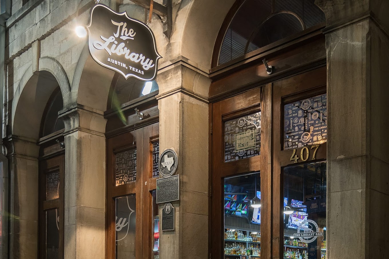The Library bar entrance in Austin, Texas at night.