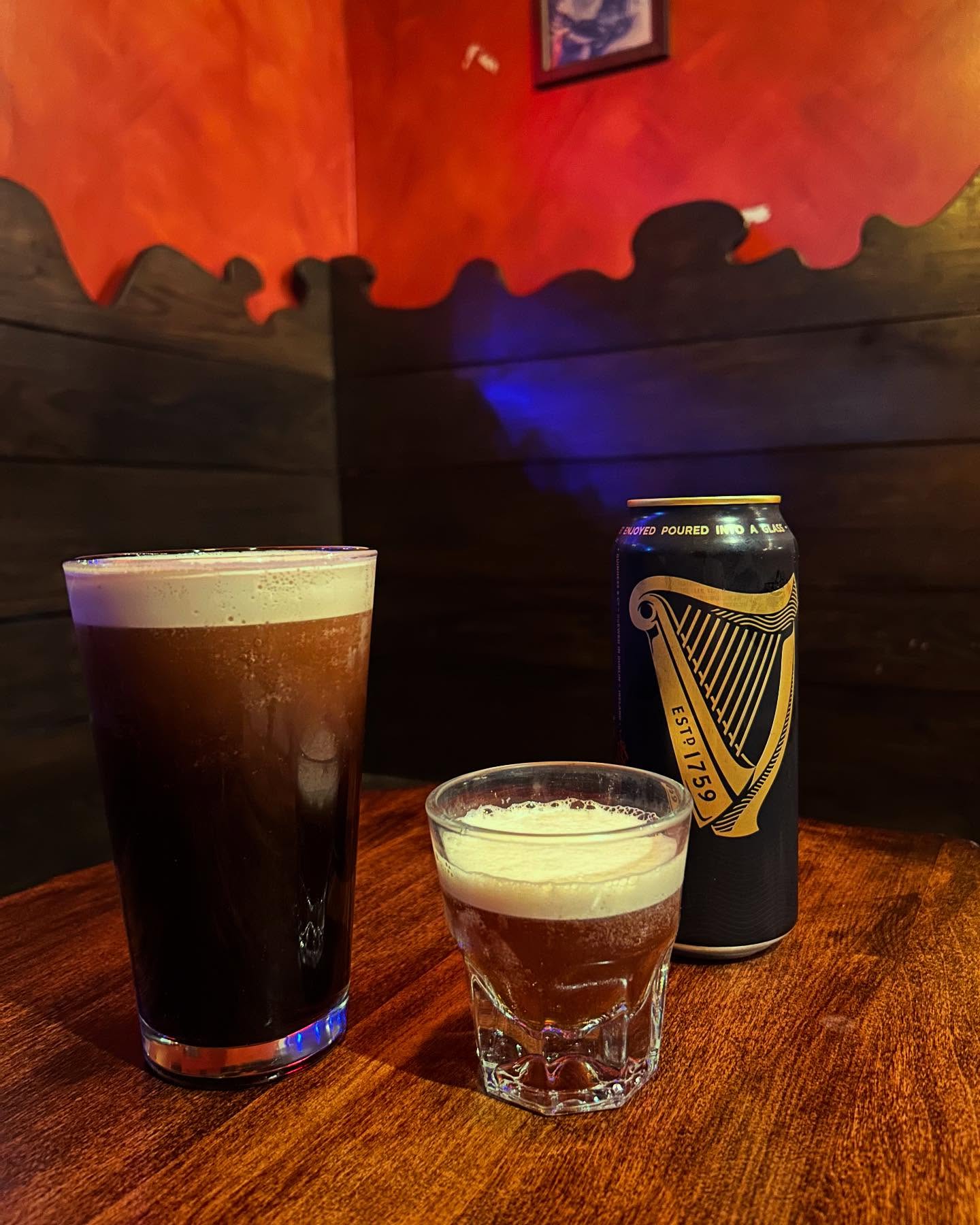 Guinness can, dark beer pint, and a small glass of beer.