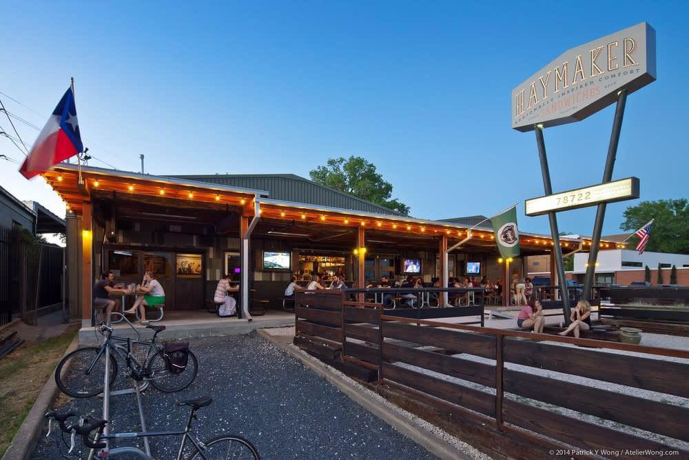 Haymaker restaurant with outdoor patio seating and parked bicycles.