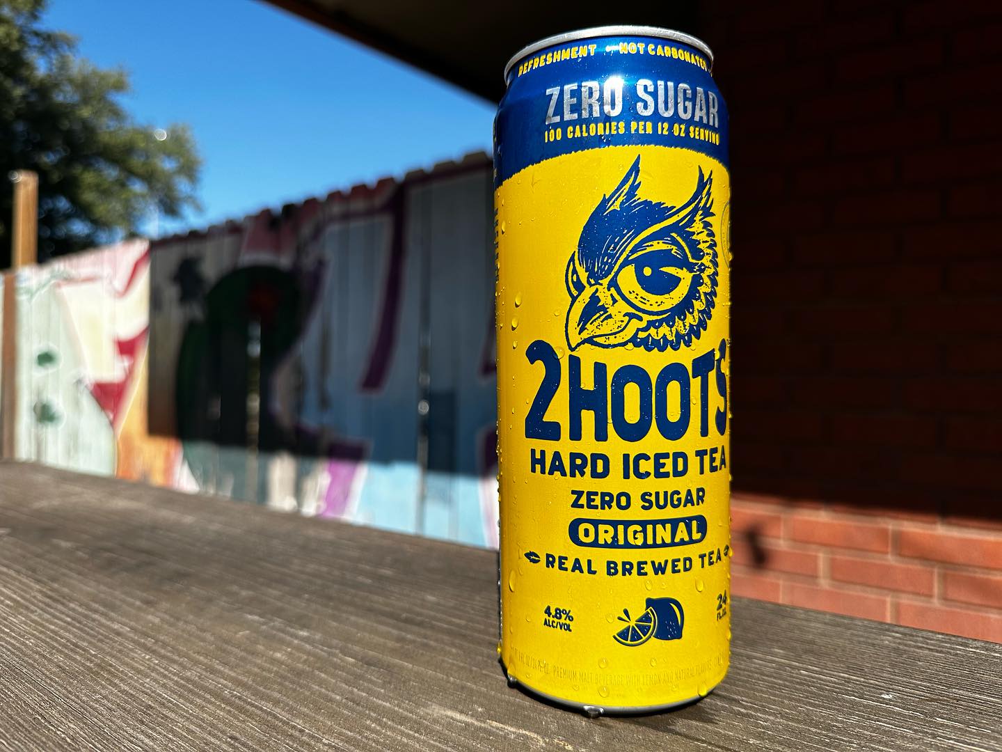 Yellow and blue 2 Hoots Hard Iced Tea can with owl logo.
