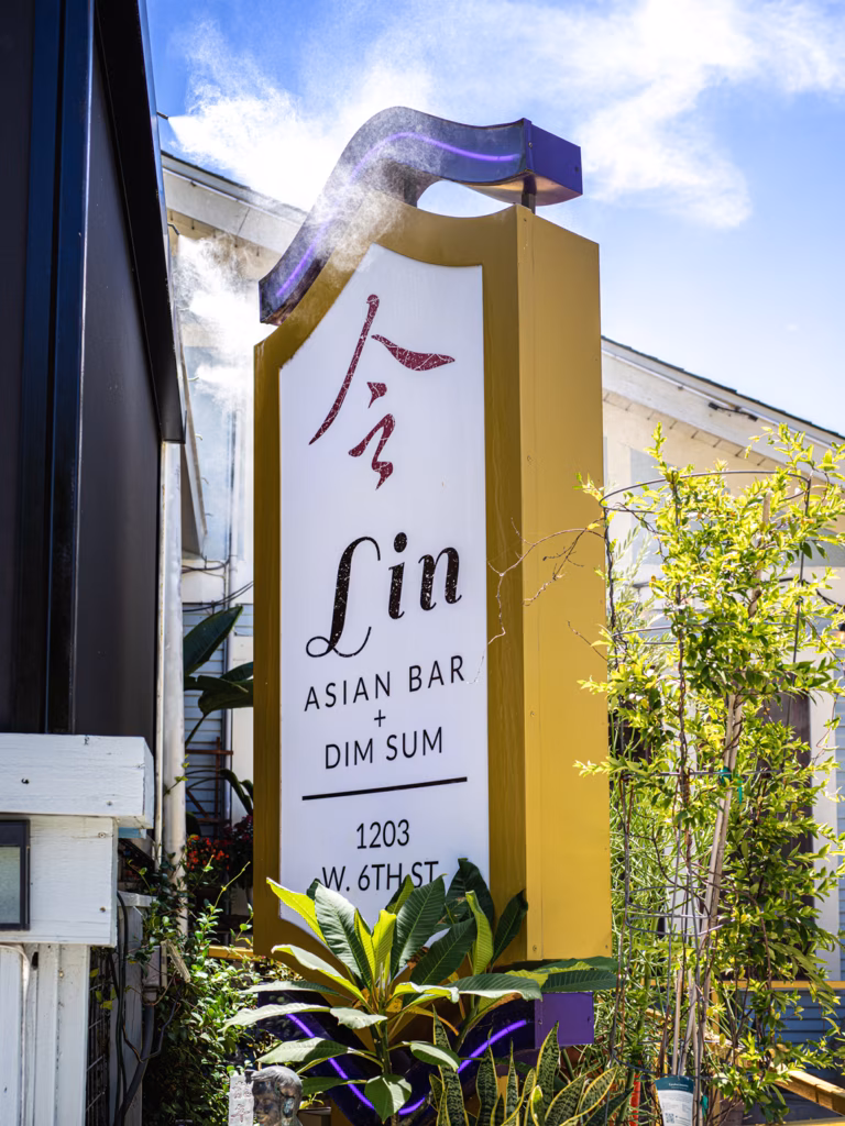 Outdoor sign for Lin Asian Bar + Dim Sum, with misting system.