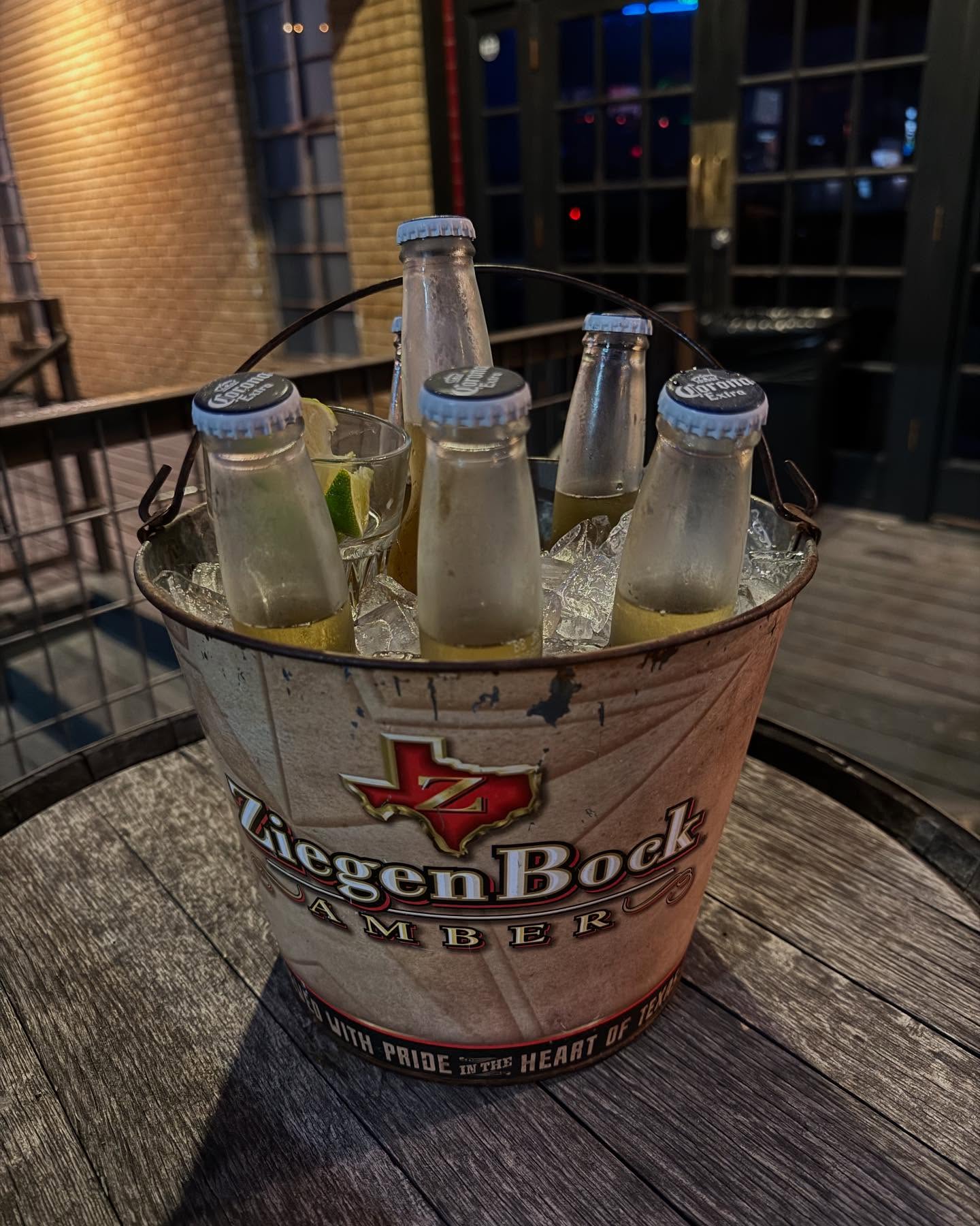 A ZiegenBock bucket filled with Corona Extra beers and ice.