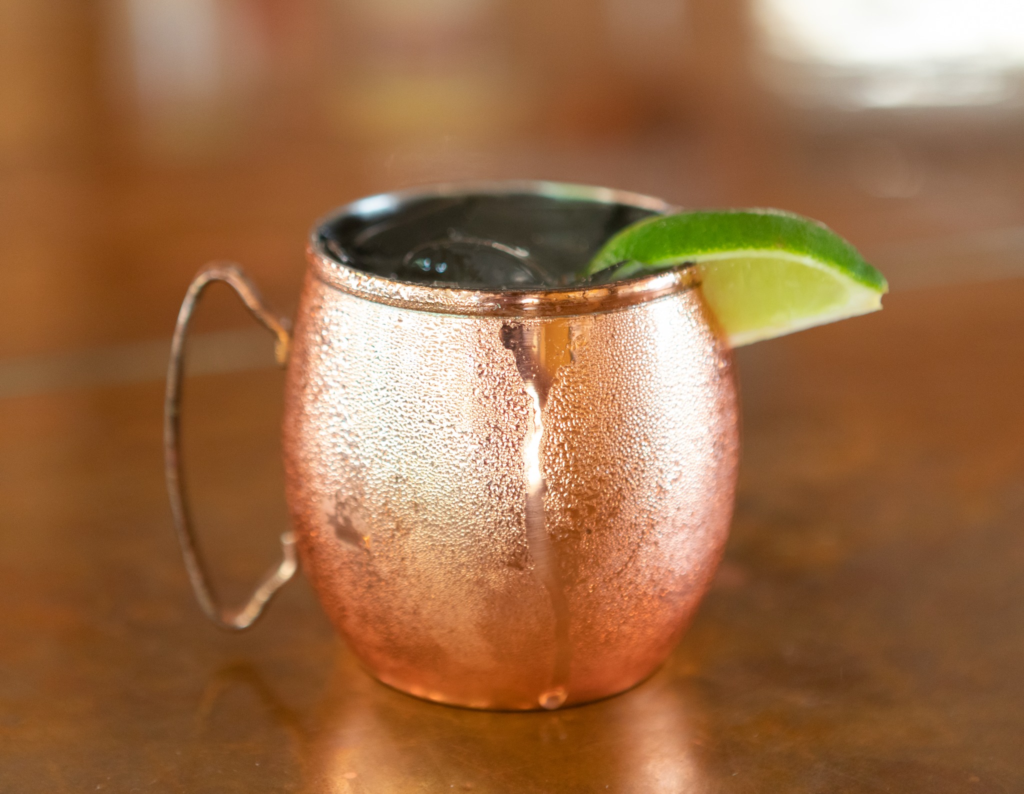 Moscow Mule in a frosty copper mug with a lime garnish.