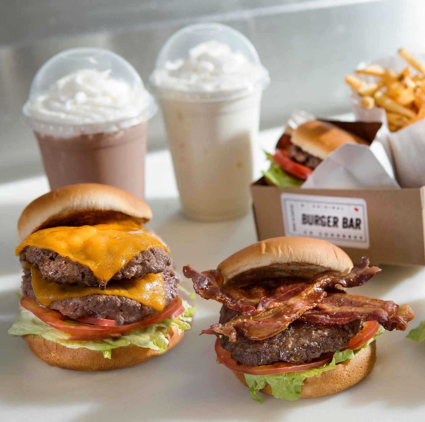 Double cheeseburger, bacon burger, milkshakes, and fries from Burger Bar.