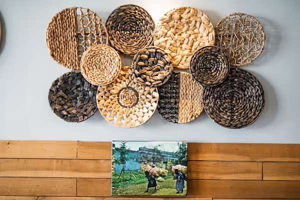 Collection of round woven natural fiber wall decor.