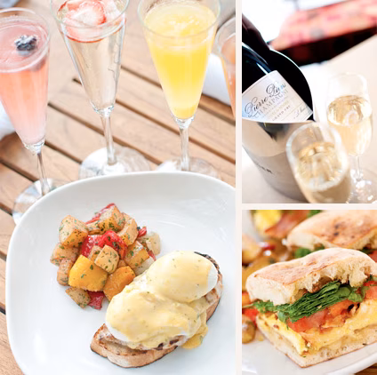 Champagne, mimosas, eggs Benedict, and a breakfast sandwich on a table.