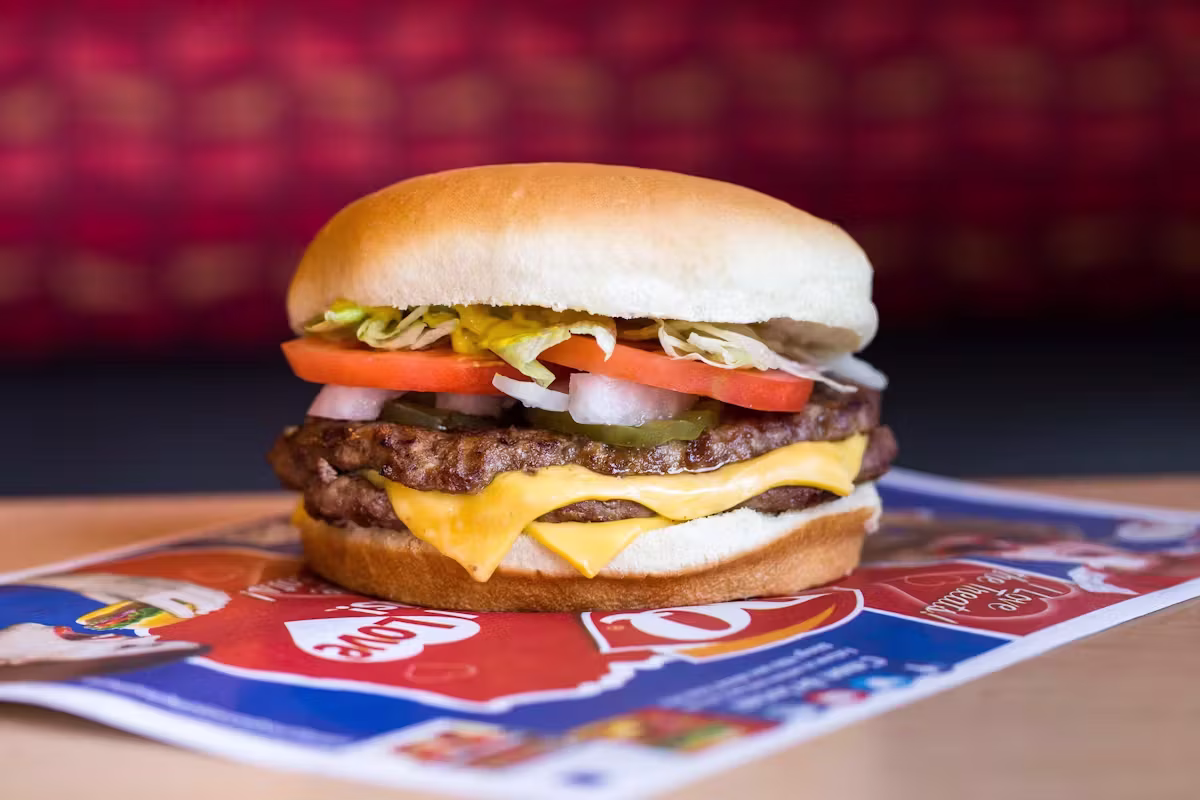Double cheeseburger with lettuce, tomato, onions, pickles, and cheese.