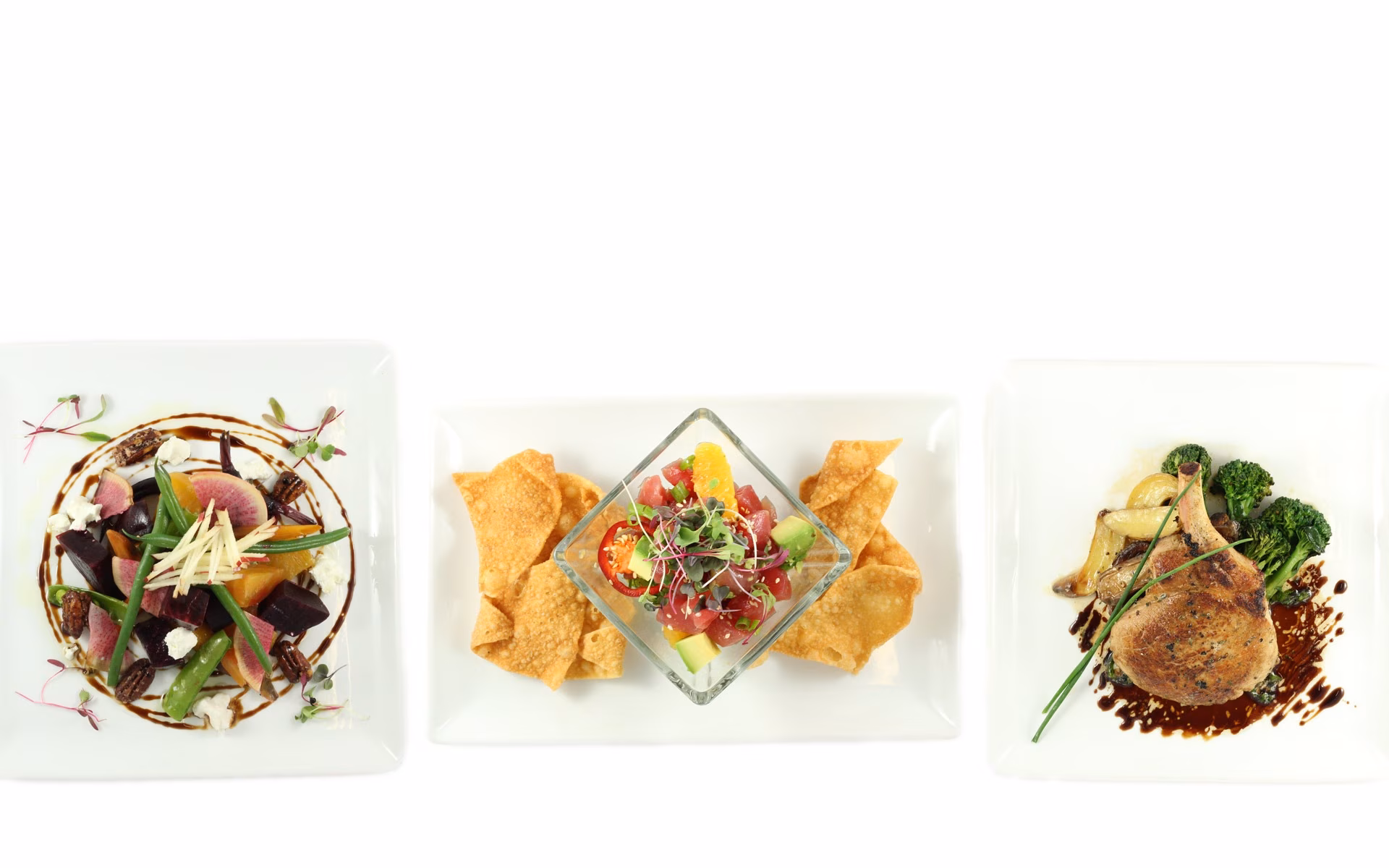 Three plated dishes: colorful salad, tuna poke, and roasted pork chop.