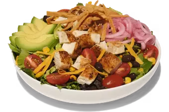 Grilled chicken salad with avocado, beans, corn, pickled onions, and tomatoes.