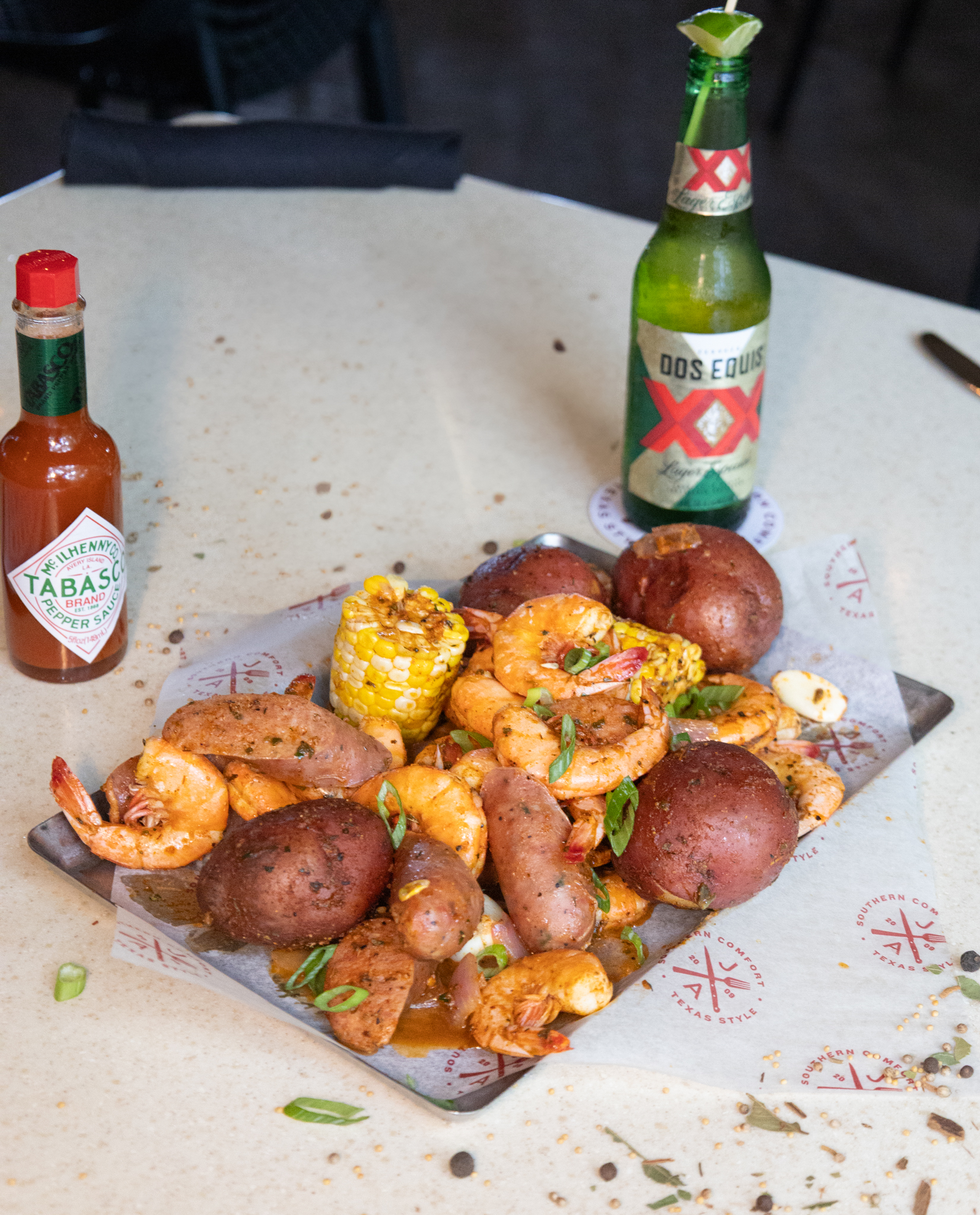 Shrimp, potatoes, corn, and sausage boil with Tabasco and Dos Equis.