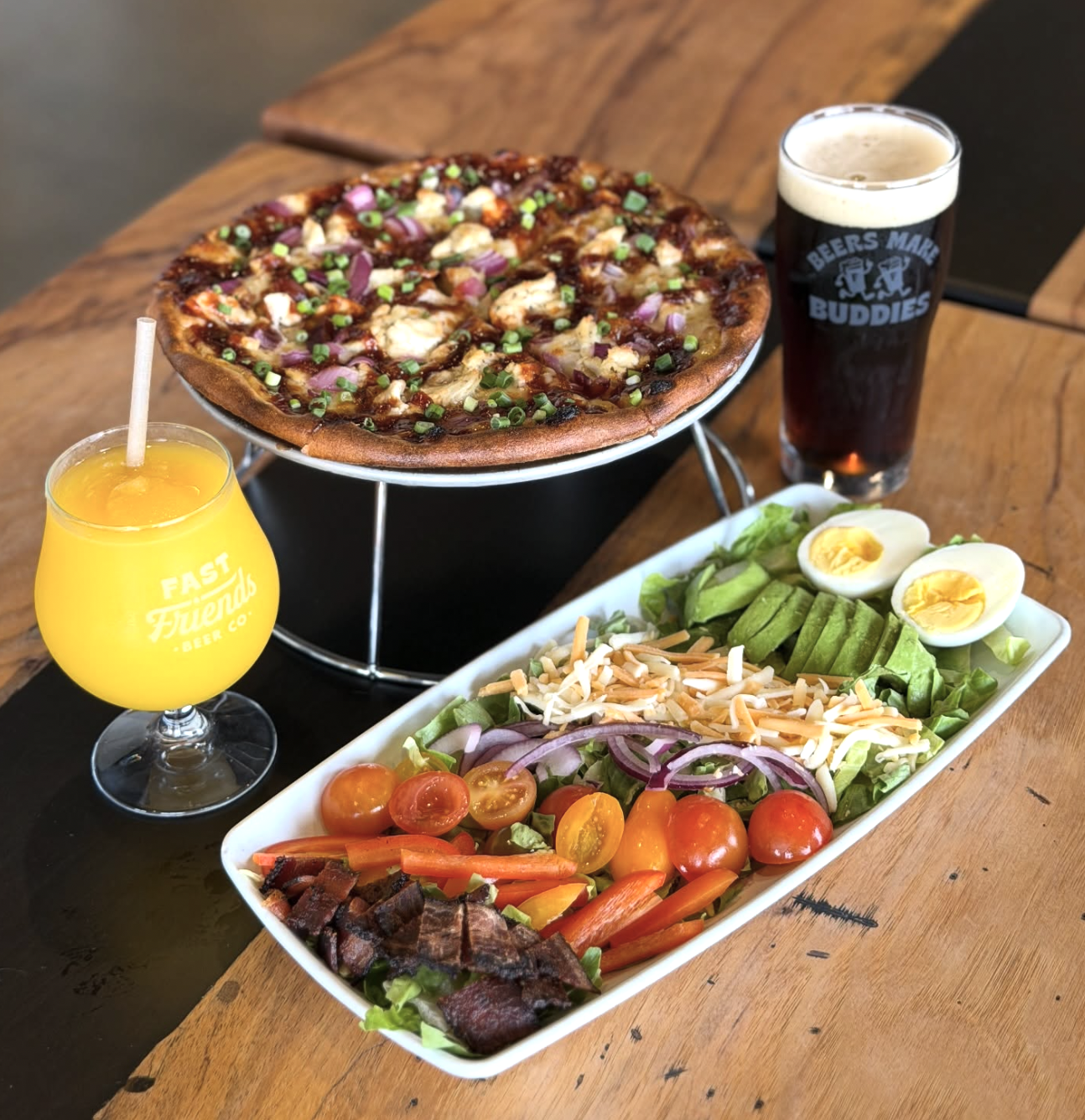 Fast Friends pizza, appetizer plate and a 2 drinks