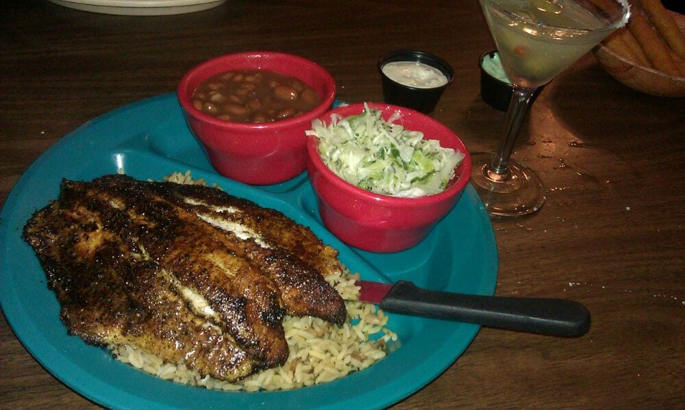 Blackened fish with rice, baked beans, coleslaw, and a martini.
